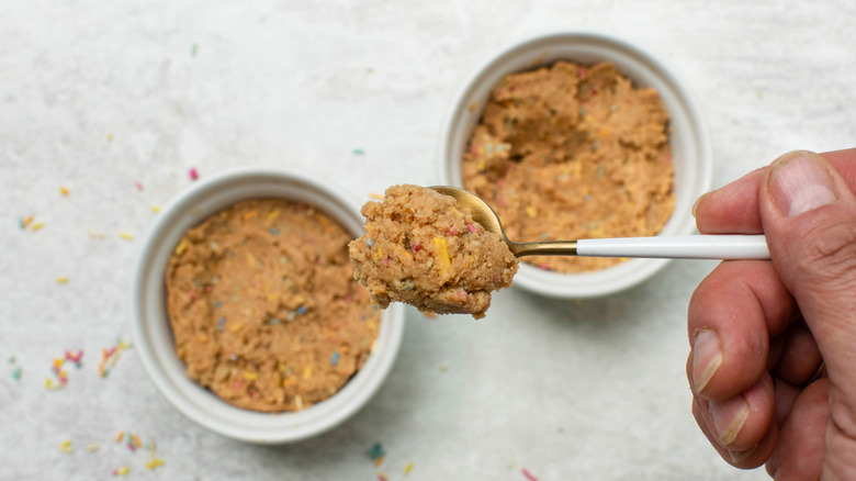 scooping cookie dough in spoon