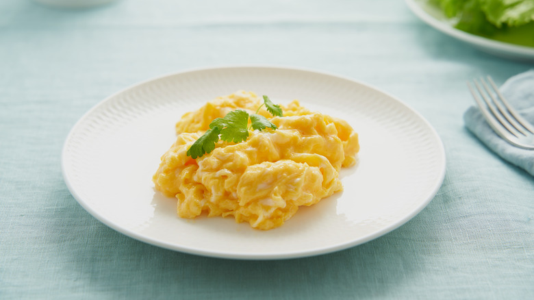 Scrambled eggs on a white plate