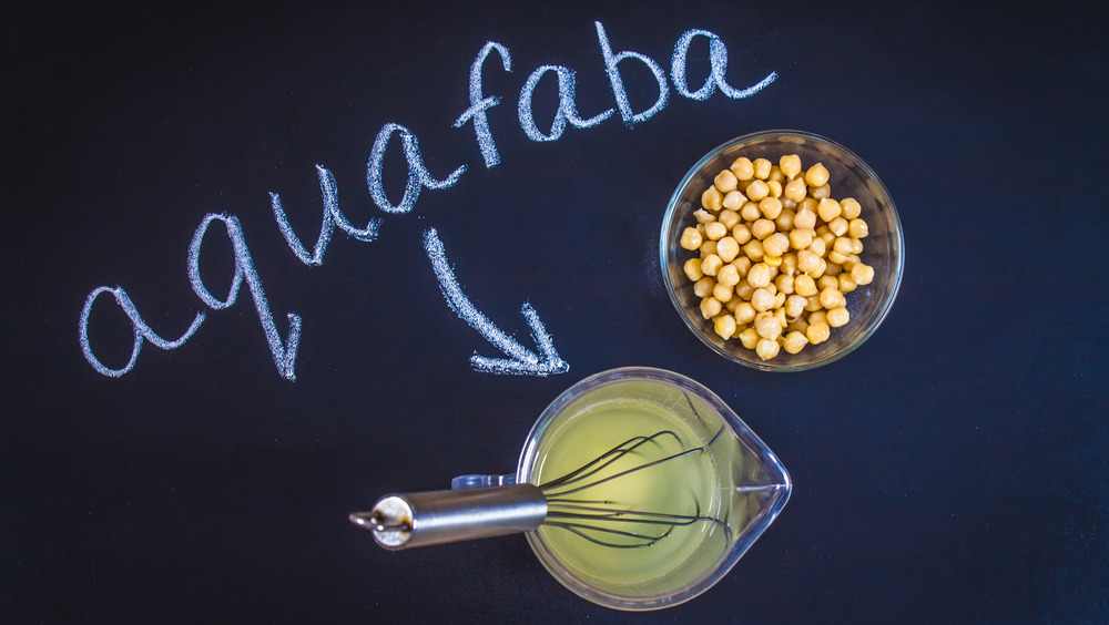 Aquafaba on a counter with a bowl of chickpeas