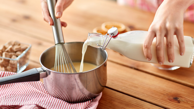 Person whisking eggnog