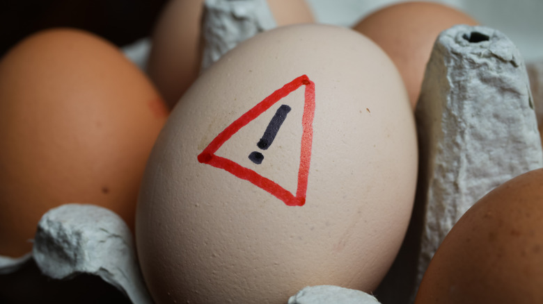 Egg with warning mark