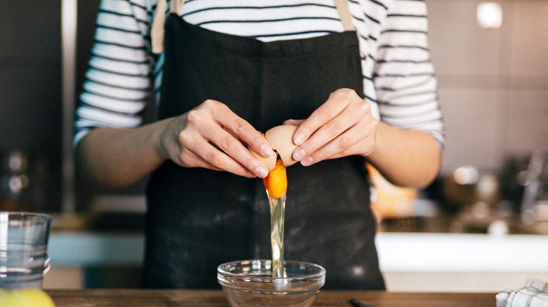 cracking egg into bowl