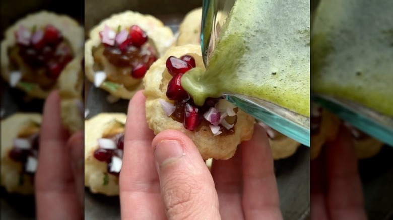 Pouring liquid on pani Poori