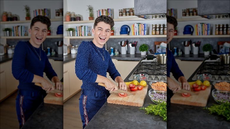 Eitan Bernath chopping veggies