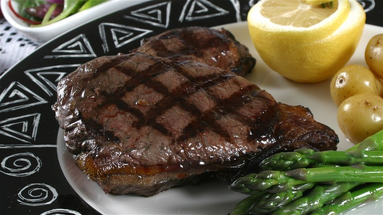 elk steak with side dishes