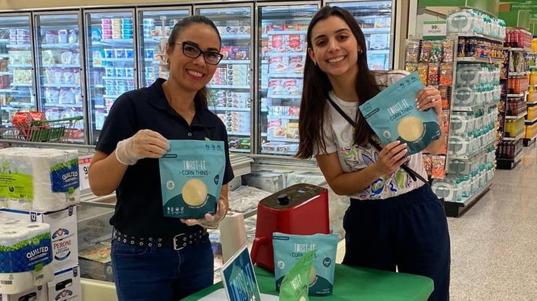 Founder in grocery store with product