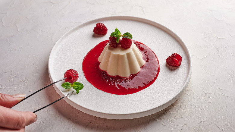 plating a dessert with tweezers