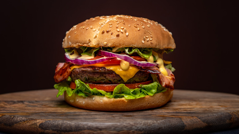 beef burger on a wooden plate