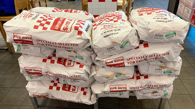 Stacks of potatoes at Five Guys