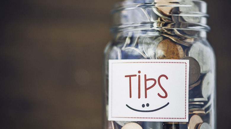 tip jar filled with coins