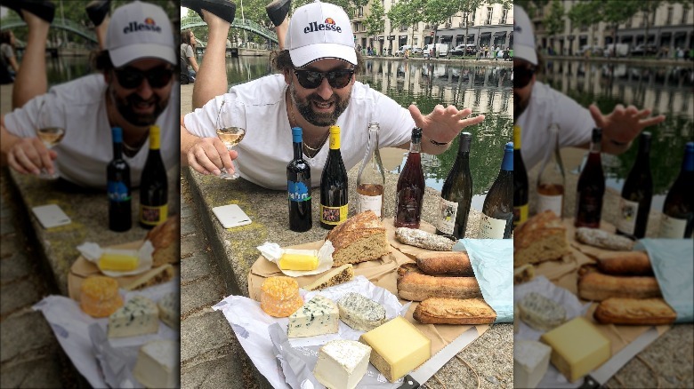 Eric Wareheim enjoying wine, cheese, and bread