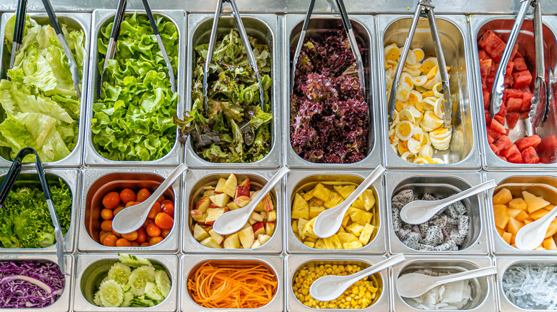 clean and organized buffet foods with tongs and spoons