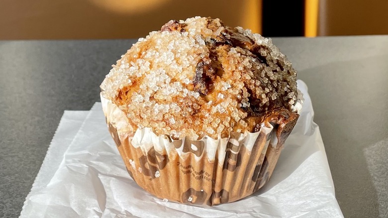 Cranberry orange muffin on parchment