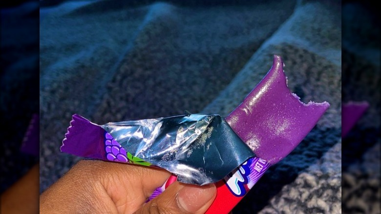 Half eaten Grape Airheads candy