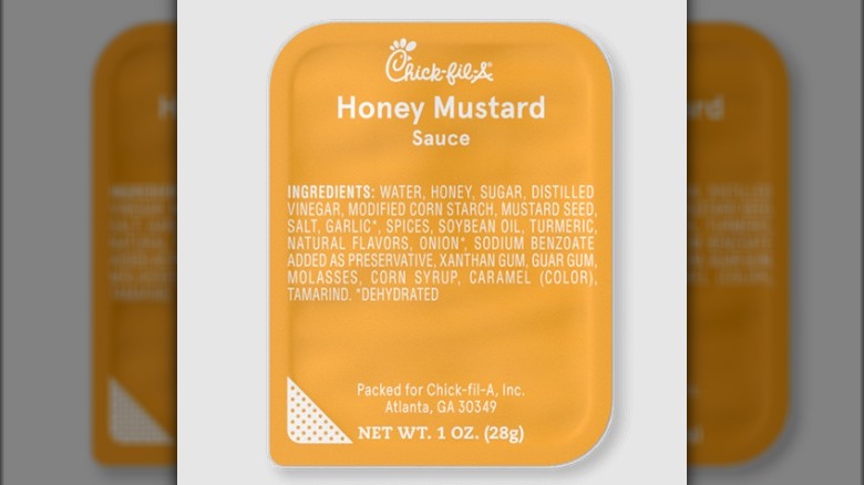 A container of Honey Mustard Sauce