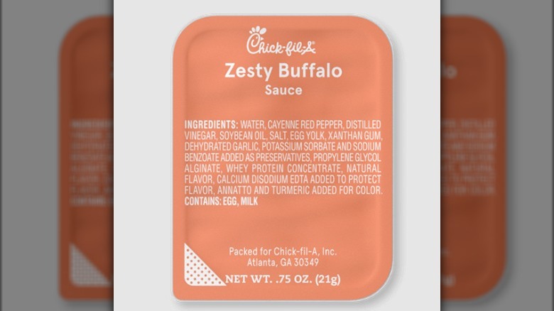 A container of Zesty Buffalo Sauce