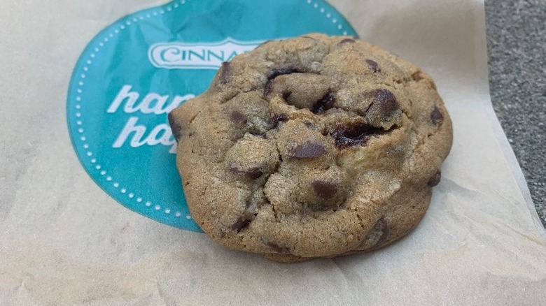 A chocolate chip cookie on a brown wrapper