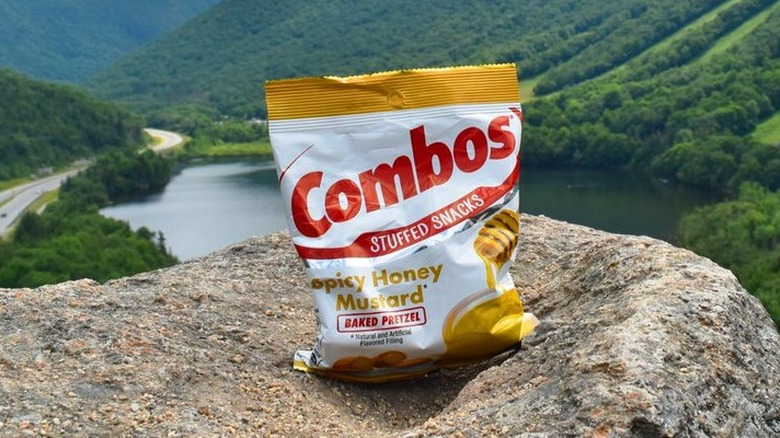 A pack of Spicy Honey Mustard Pretzels in the mountains