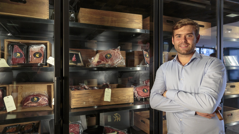 Alexandre Polmard beside meat storage