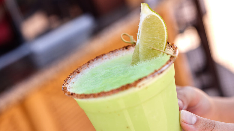 frozen lime dole whip margarita at the barefoot pool bar at disney's polynesian resort