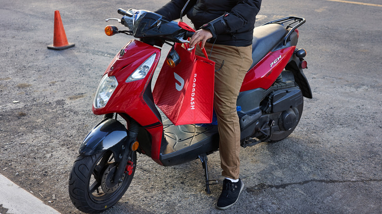 DoorDash driver on motorbike