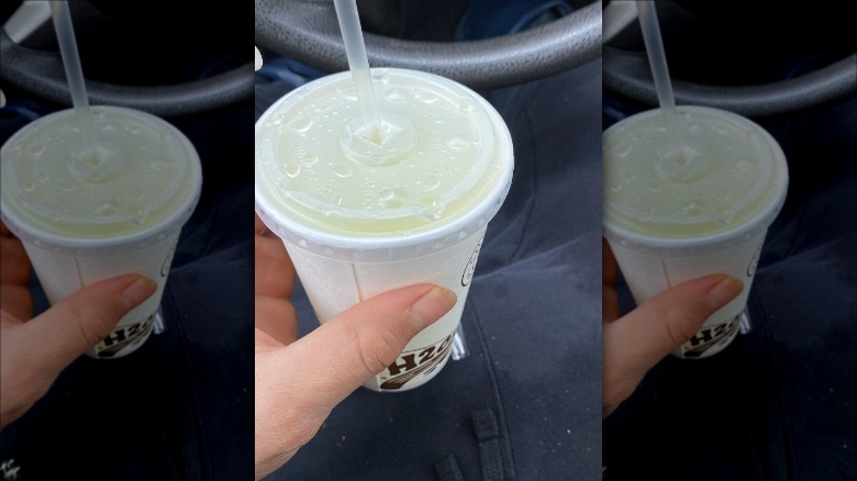 Chipotle lemonade held in car