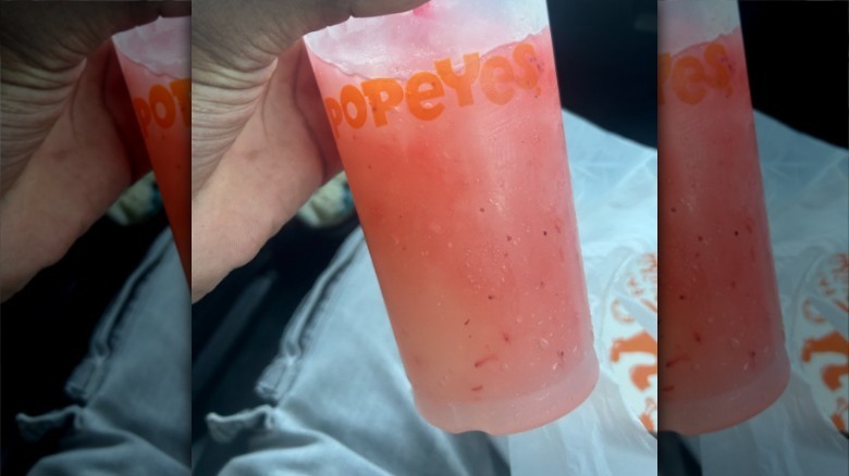 Popeyes lemonade held in car