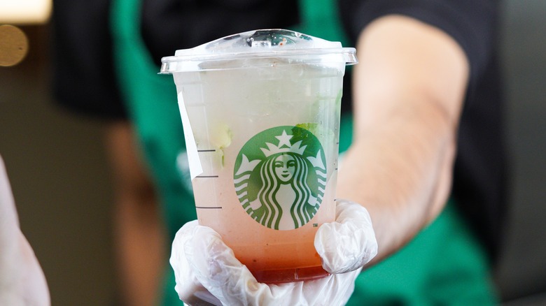 Starbucks raspberry lemonade handed to customer