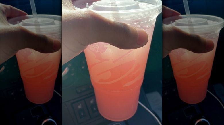 Taco Bell lemonade held in car