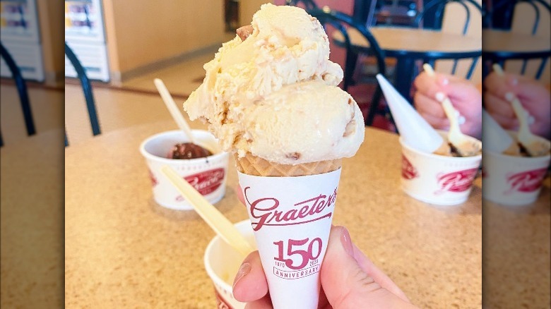 hand holding butter pecan ice cream