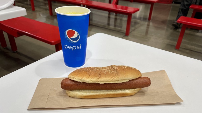 Costco hot dog and soda on table