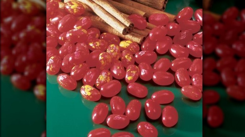 Pile of Cinnamon jellybeans with cinnamon sticks