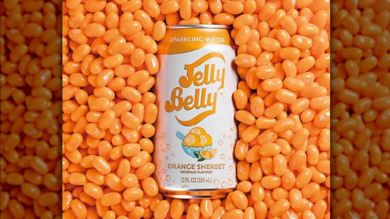 Can of Jelly Belly sparkling water in front of Orange Sherbet jellybeans