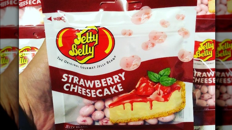 Several bags of Strawberry Cheesecake jellybeans with one in the foreground