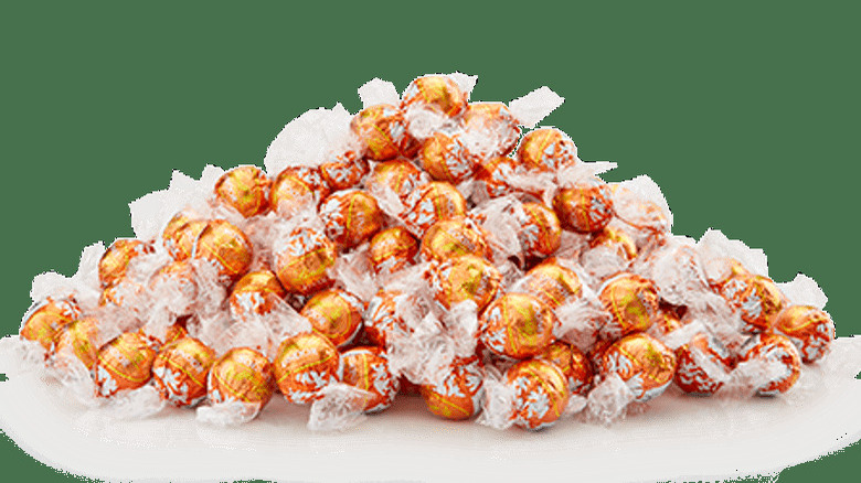 Pile of wrapped orange chocolates