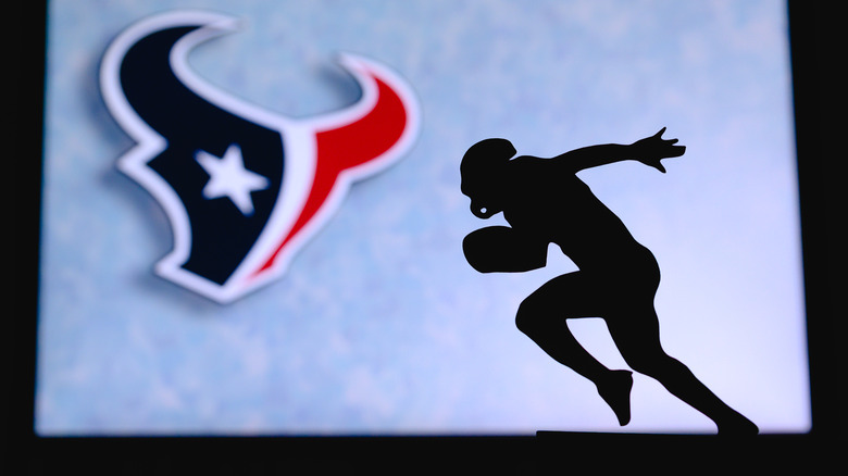 running silhouette with texans logo