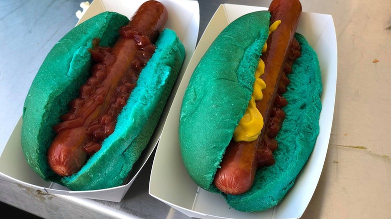 2 hot dogs in teal buns