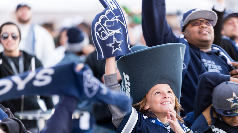 smiling young cowboys fan