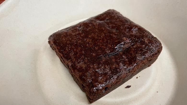 chocolate brownie on cardboard plate