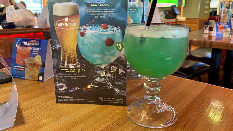 blue-green cocktail in a cup