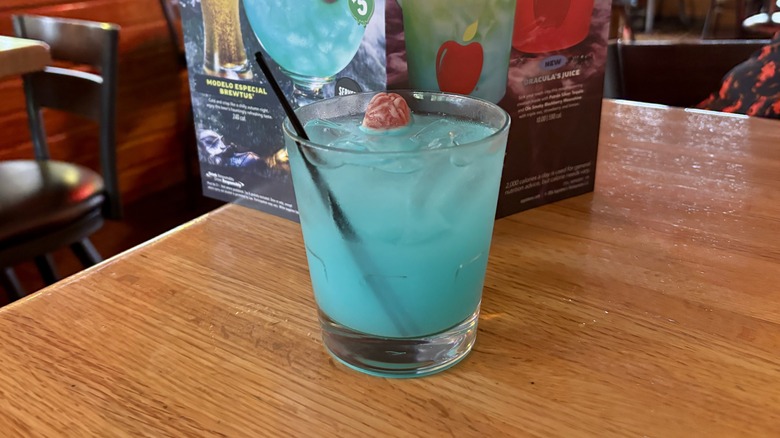 blue cocktail in a cup