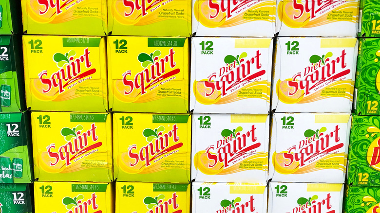 Stacked 12 packs of Squirt and Diet Squirt.