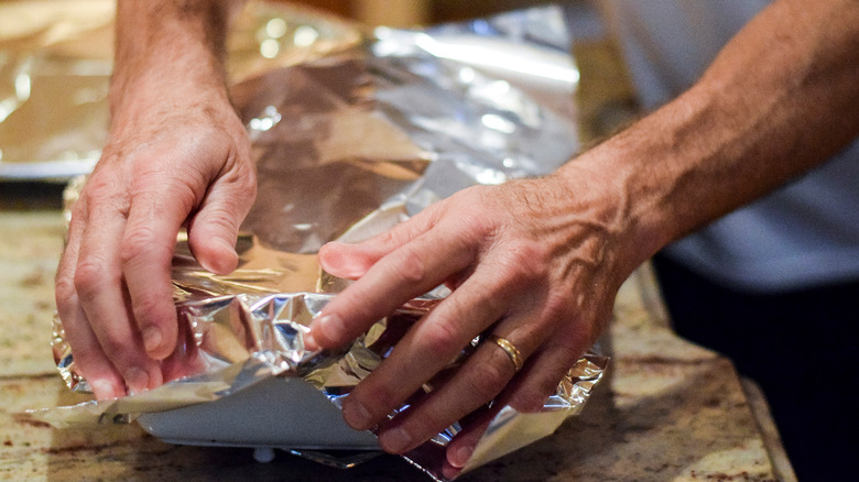 covering casserole dish in aluminum foil