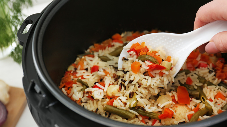 slow cooker with rice inside