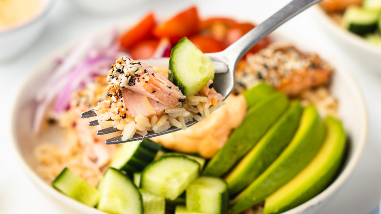 salmon and cucumber on fork