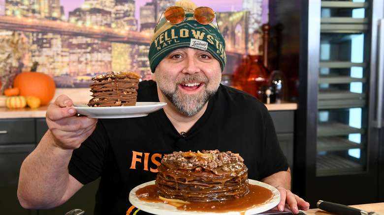 Duff Goldman holding desserts