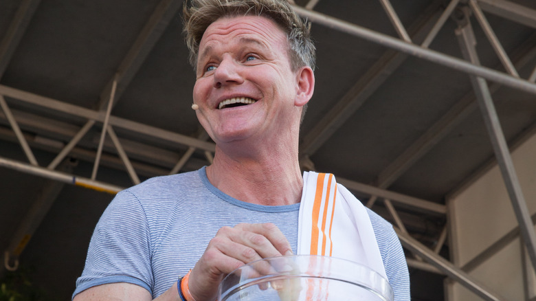 Gordon Ramsay cooking on stage at event