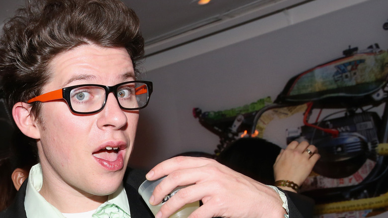 Justin Warner holding drink