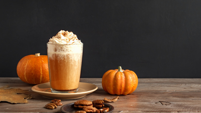 pumpkin spice latte and small pumpkins