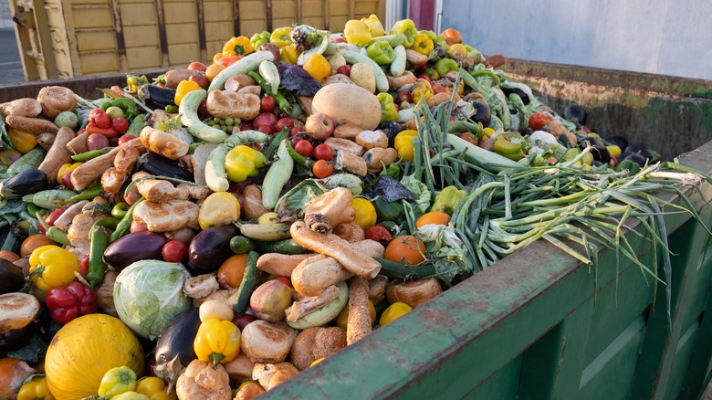 food waste in green dumpster